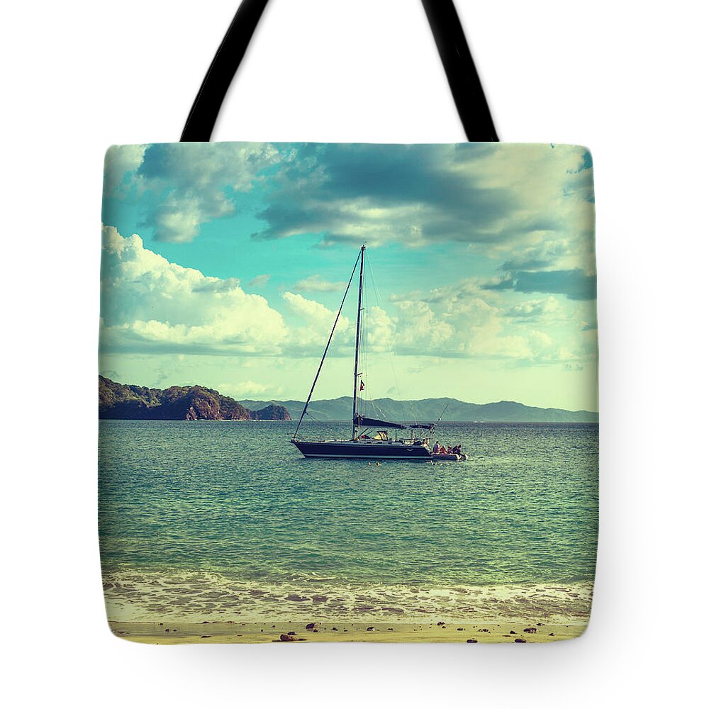 Sailboat Tote Bag featuring the photograph Sailboat by Thepalmer