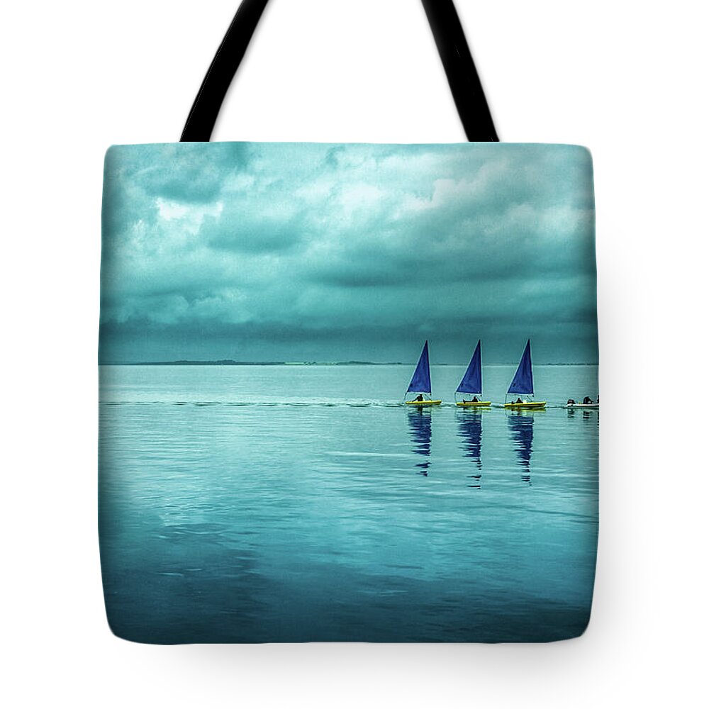 Tranquility Tote Bag featuring the photograph Sailing From Storms To Serenity by Michael Marsh/stocks Photography/getty Images
