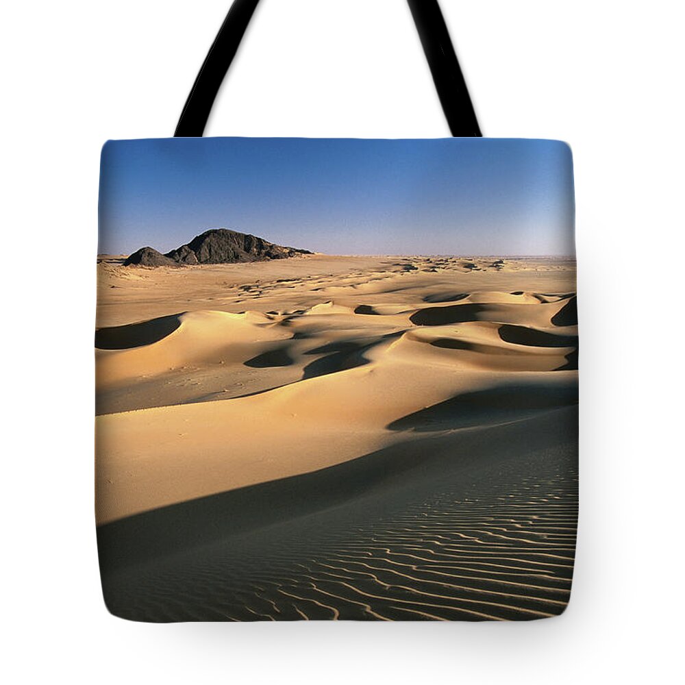 Sand Dune Tote Bag featuring the photograph Sand Dunes Of Ilekane In Tenere Part Of by Frans Lemmens