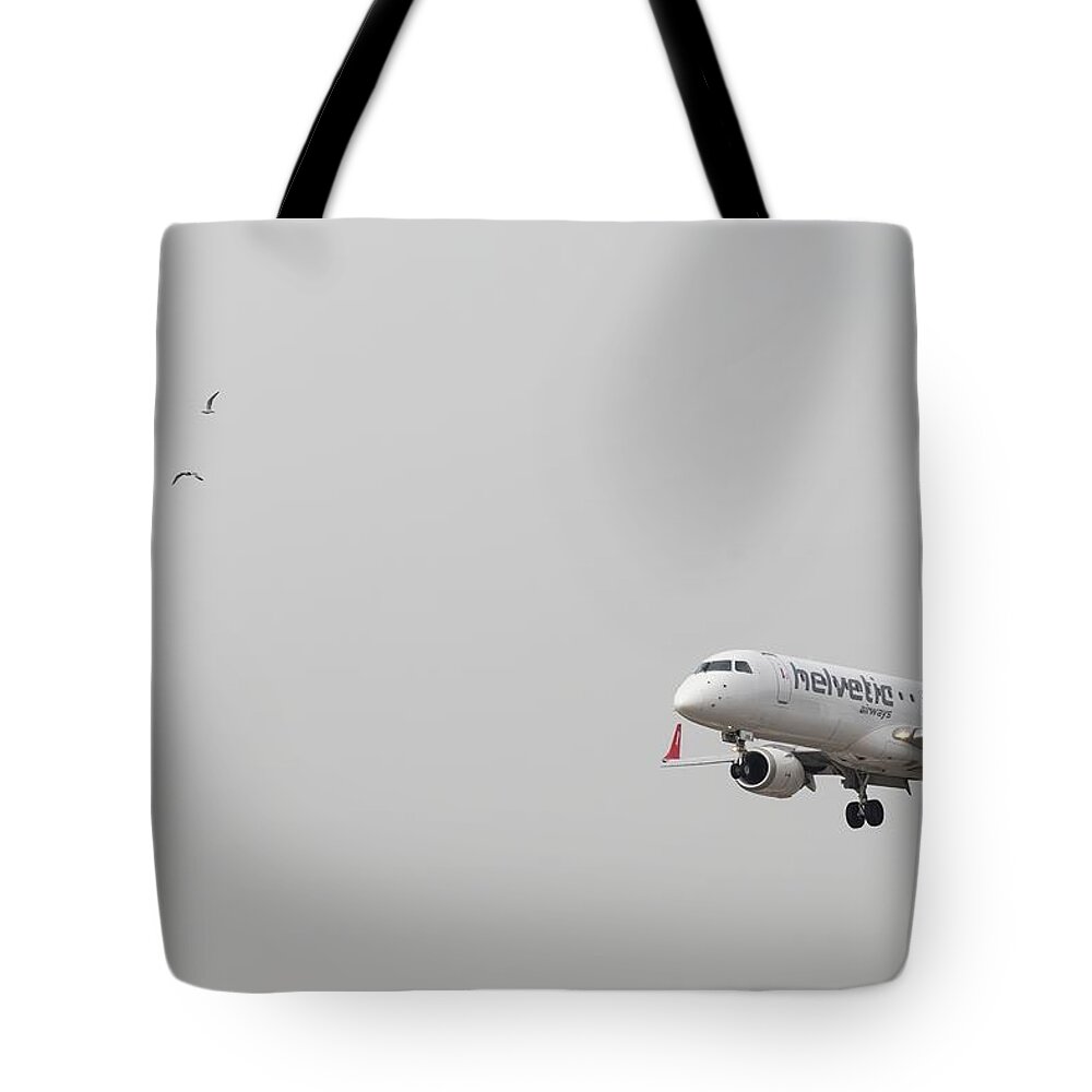 Seagulls Tote Bag featuring the photograph Seagulls And Airliner by David Pyatt