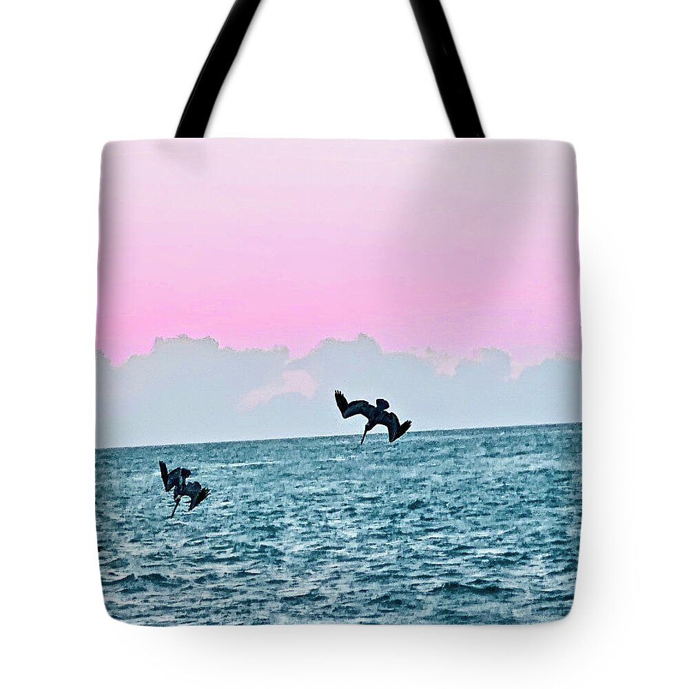 Birds Tote Bag featuring the photograph Seagulls Diving for Dinner at Sunset in Captiva Island Florida by Shelly Tschupp