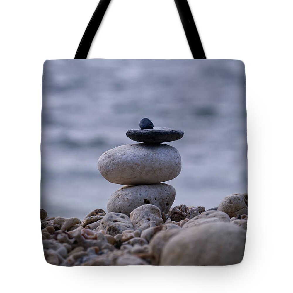 Rock Stacking Tote Bag featuring the photograph Serenity by Eric Hafner