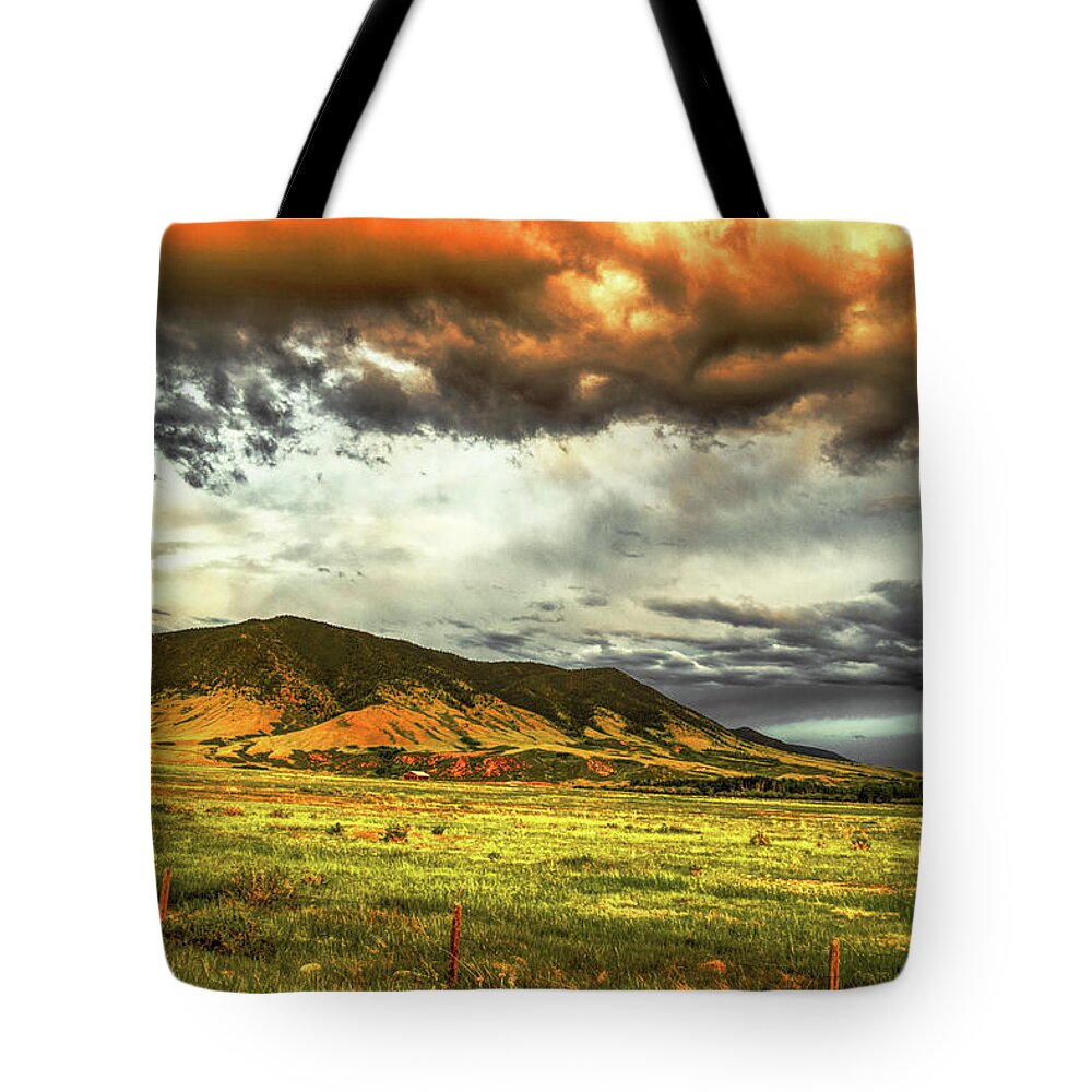 Laramie Tote Bag featuring the photograph Sheep Mountain Drama by Chance Kafka