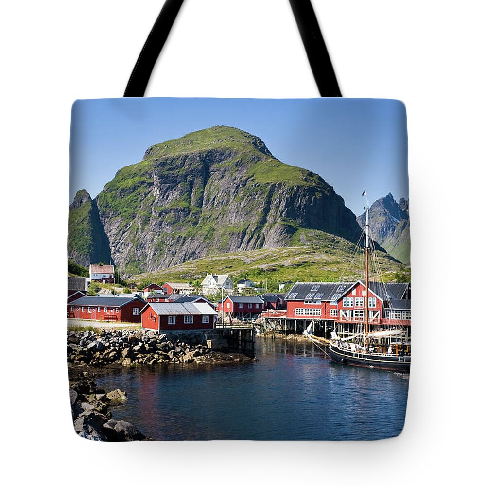 Scenics Tote Bag featuring the photograph Ship Entering Harbour In Lofoten by Johansjolander