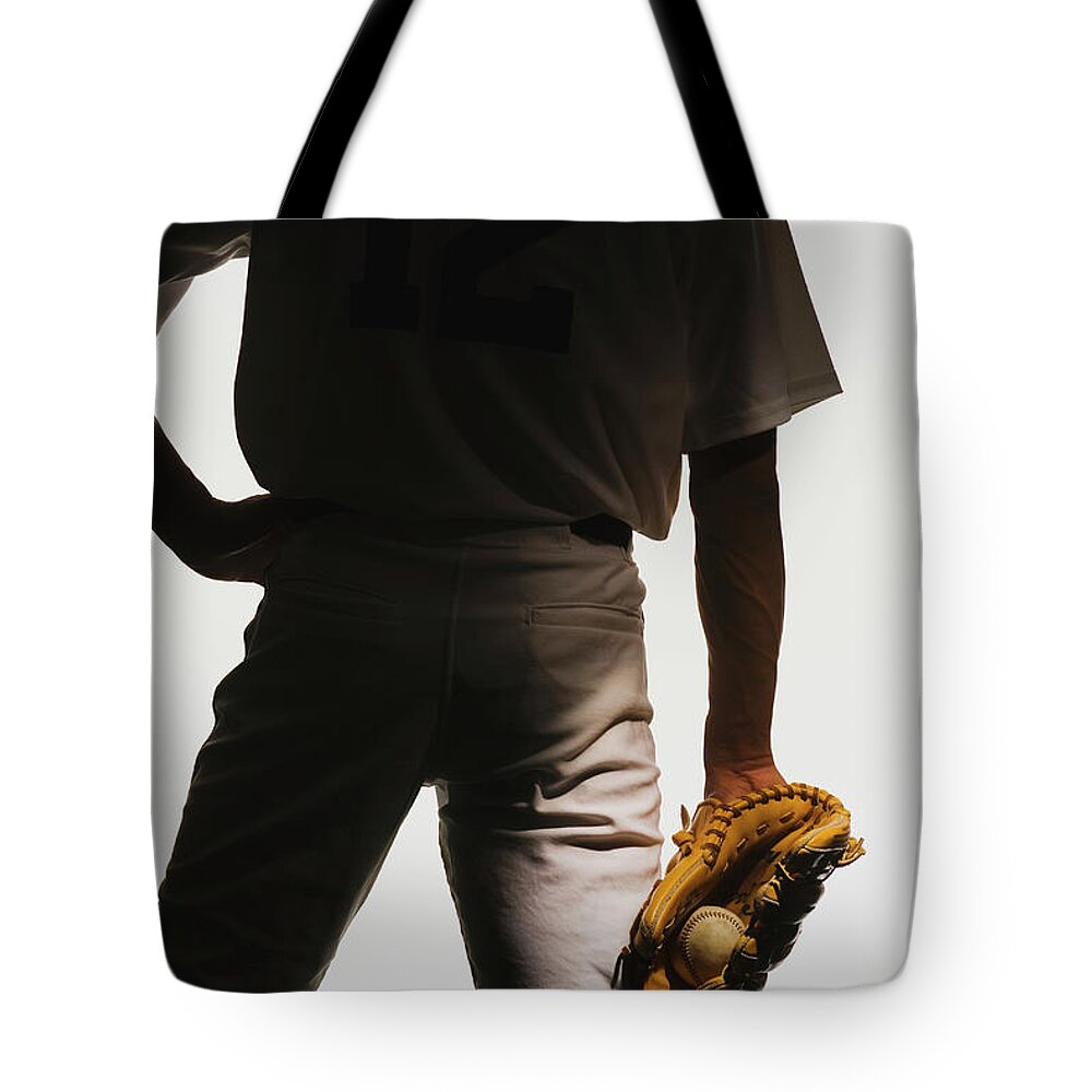People Tote Bag featuring the photograph Silhouette Of Baseball Pitcher With by Pm Images