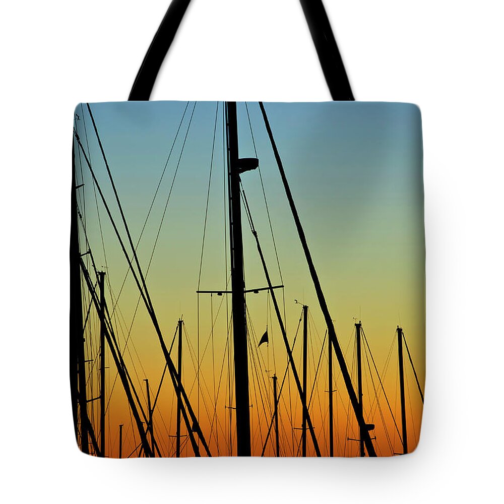 Sailboat Tote Bag featuring the photograph Silhouettes Of Sail Boat Masts And by Joseph Shields