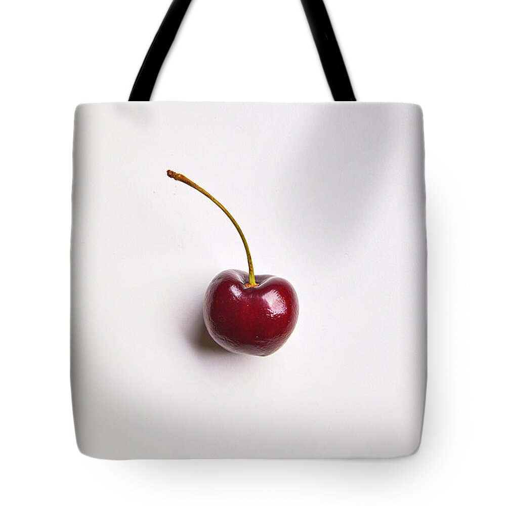 Cuisine At Home Tote Bag featuring the photograph Single cherry by Cuisine at Home