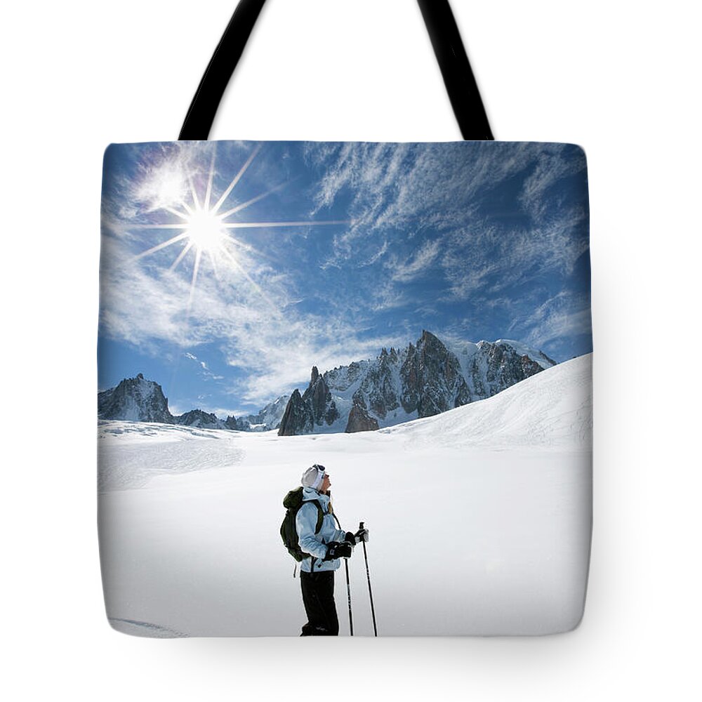 Skiing Tote Bag featuring the photograph Skier Going Downhill Chamonix France by Henrik Trygg