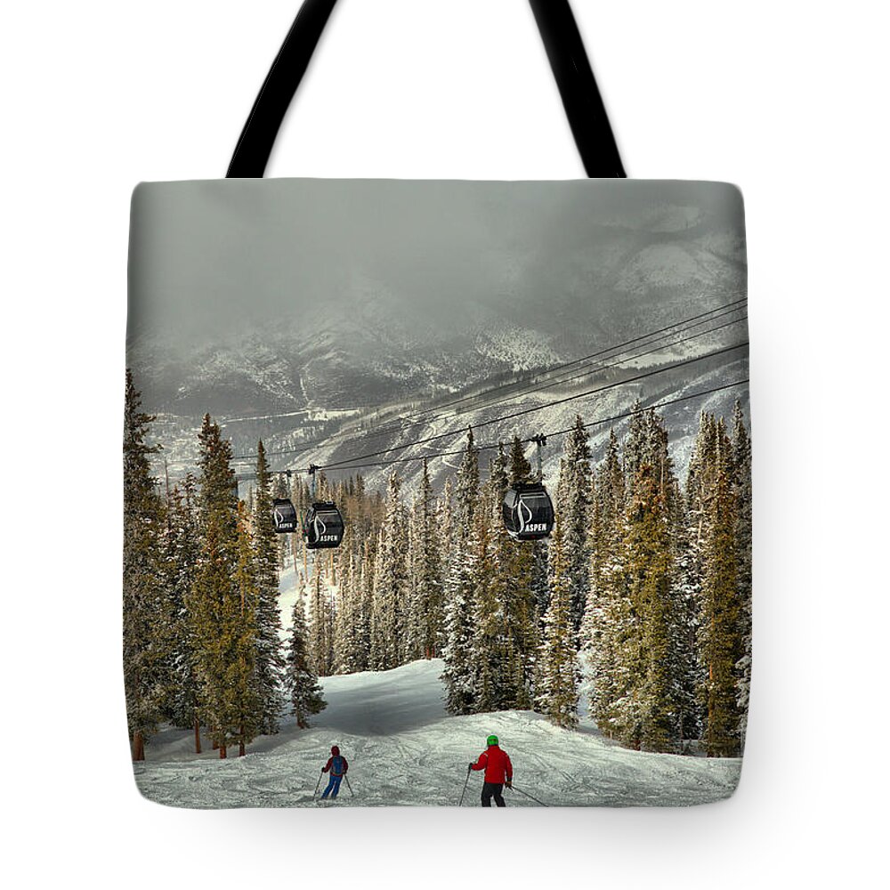 Aspen Gondola Tote Bag featuring the photograph Skiers Under The Aspen Gondola by Adam Jewell