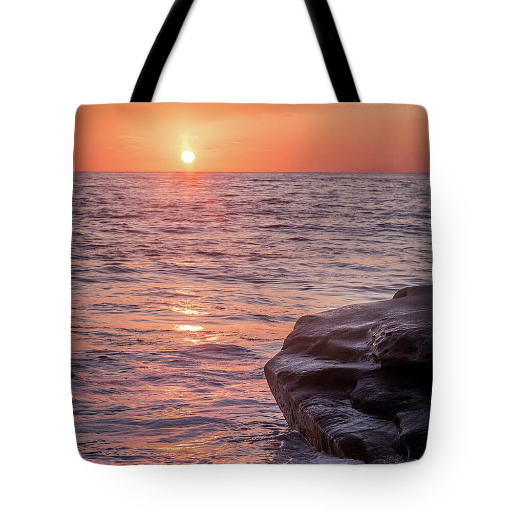 Beach Tote Bag featuring the photograph Skies of Orange by Aaron Burrows