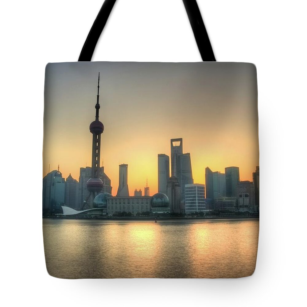The Bund Tote Bag featuring the photograph Skyline At Sunrise by Photo By Dan Goldberger