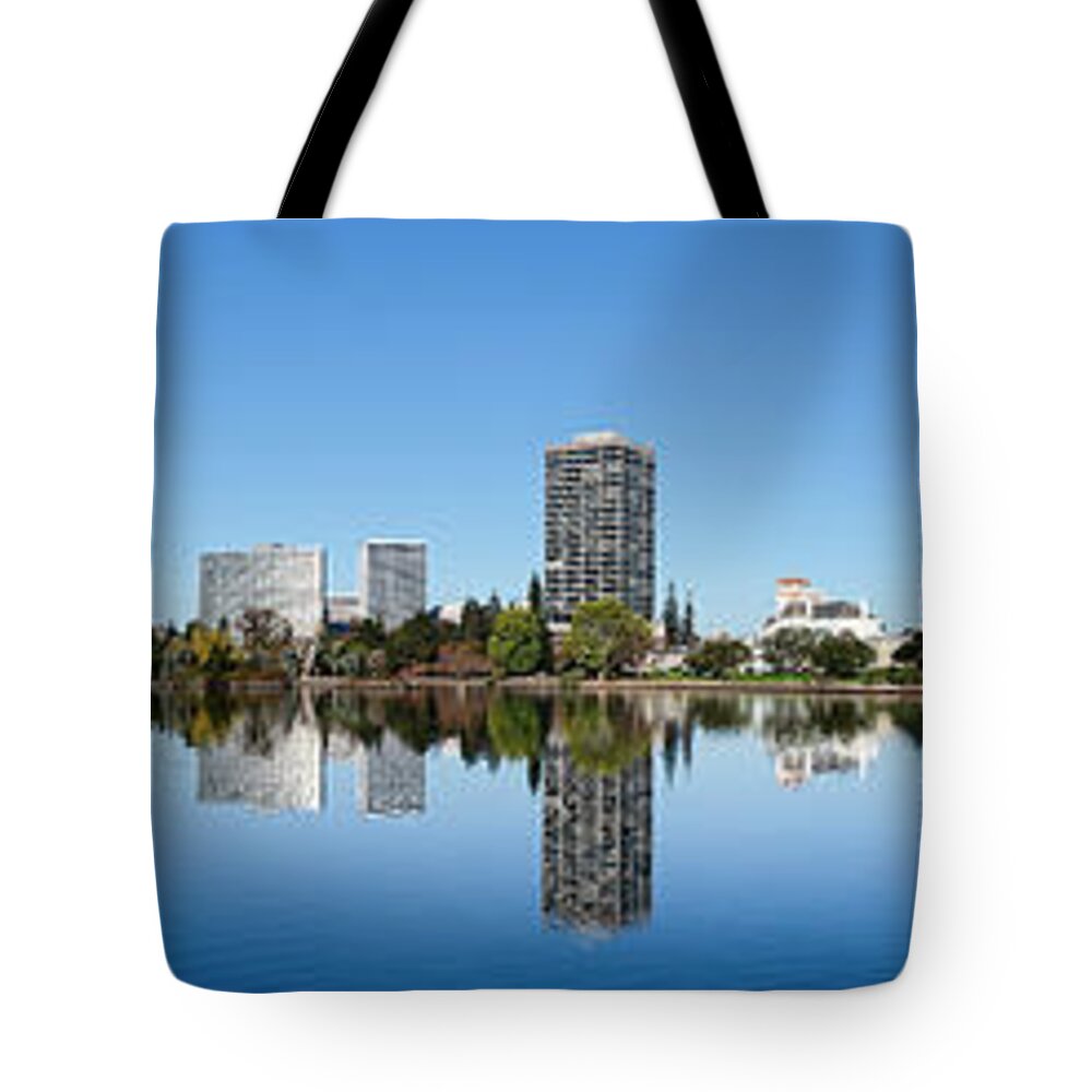 Photography Tote Bag featuring the photograph Skyline Of Oakland And Lake Merritt by Panoramic Images