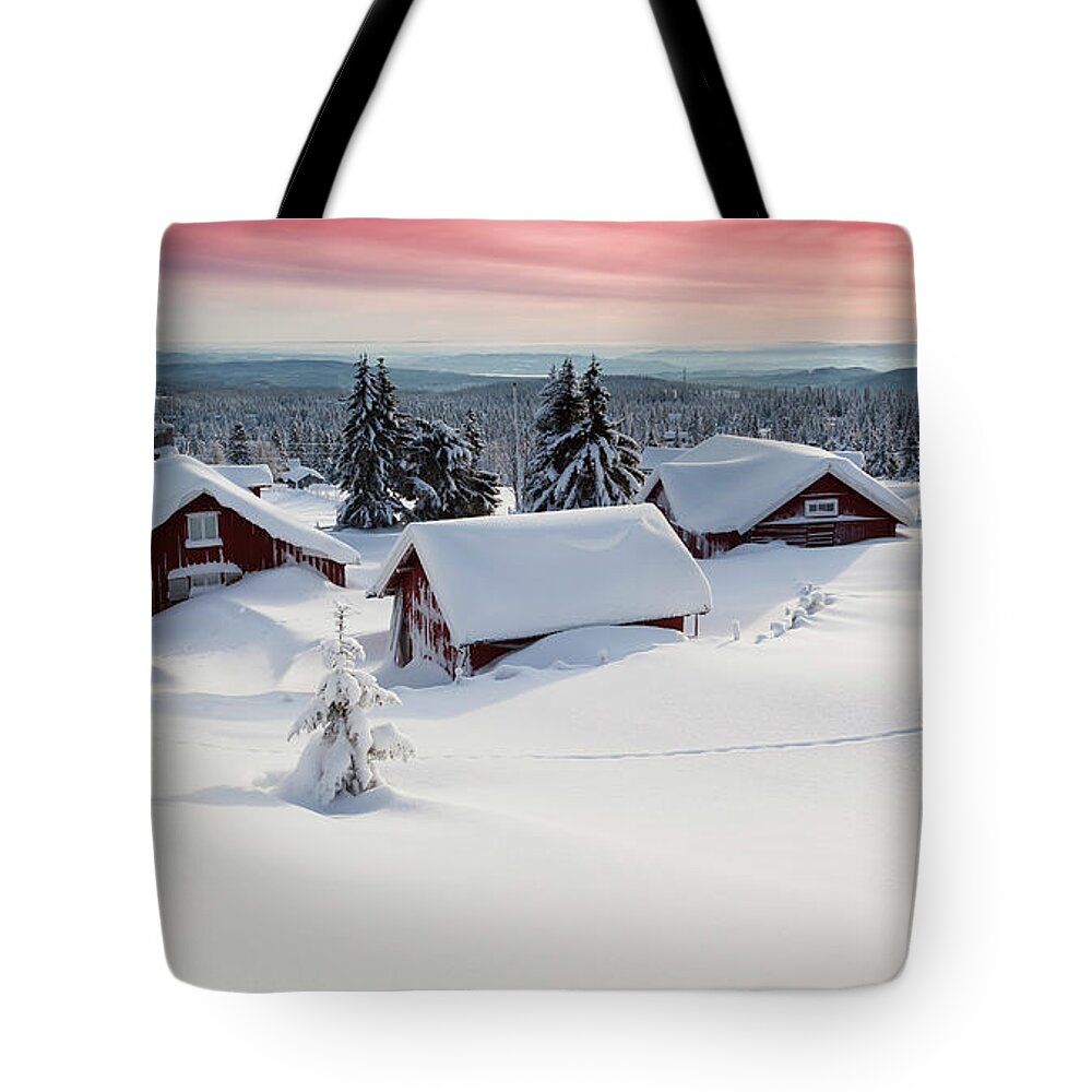 Tranquility Tote Bag featuring the photograph Snow Covered Log Cabins At Sunset by Rob Kints
