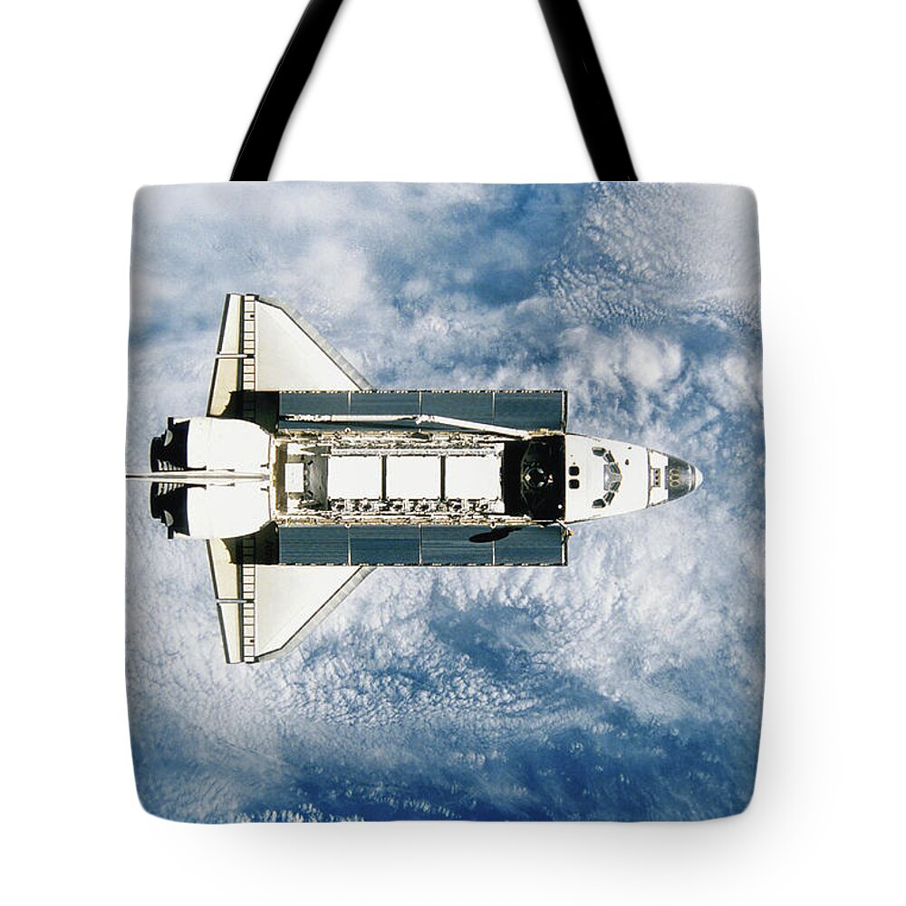 Outdoors Tote Bag featuring the photograph Space Shuttle Orbiting Earth, Satellite by Stocktrek