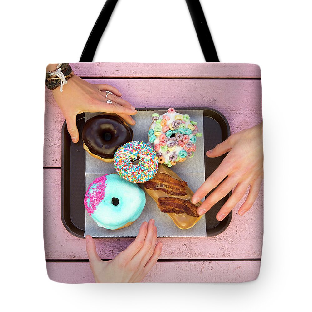 Young Men Tote Bag featuring the photograph Specialty Doughnuts On A Tray by Jordan Siemens