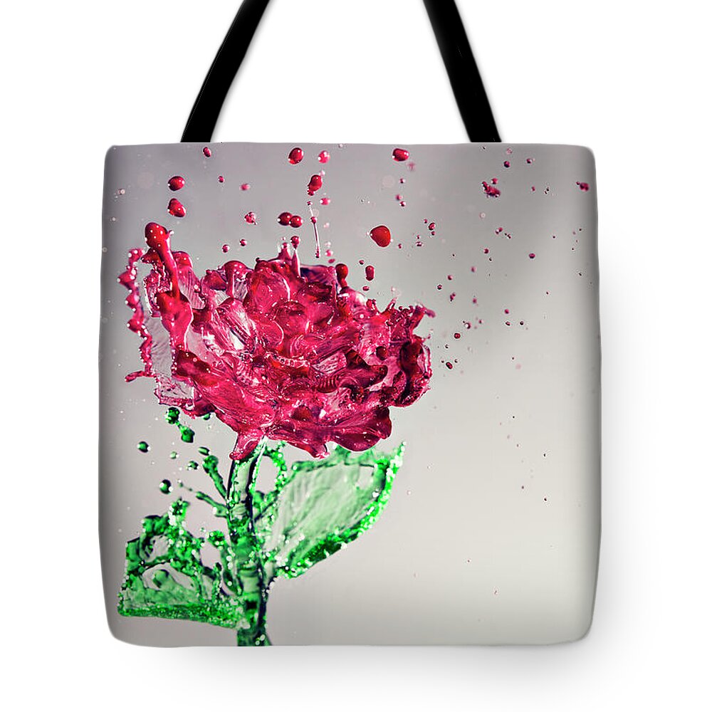 Motion Tote Bag featuring the photograph Splash Of Rose by Yugus