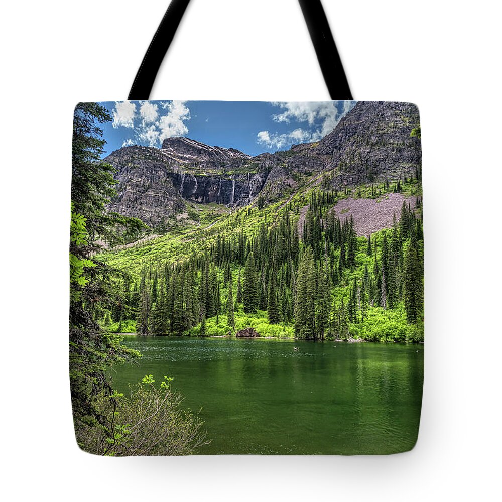 Glacier National Park Tote Bag featuring the photograph Spring at Snyder Lake by Kenneth Everett