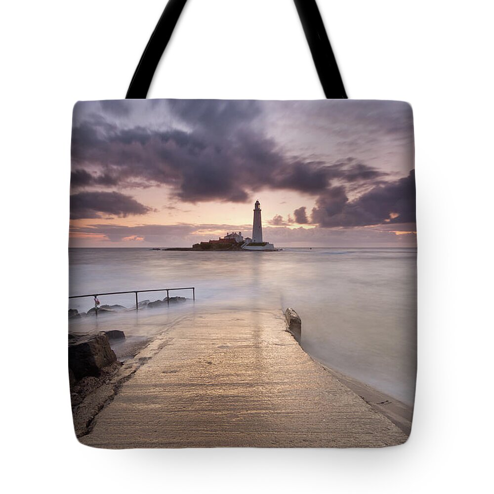 Sunrise Tote Bag featuring the photograph St Mary's Lighthouse by Anita Nicholson