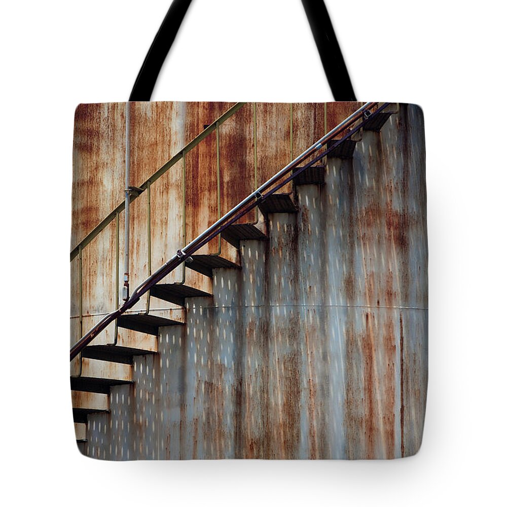 Steps Tote Bag featuring the photograph Staircase On A Rusting Iron Structure by Mint Images - Art Wolfe