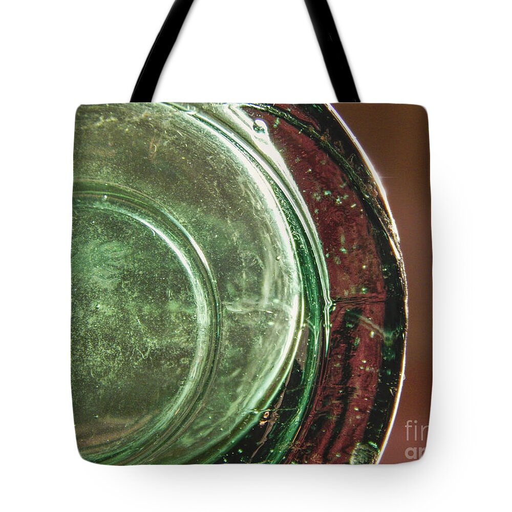 Macro Tote Bag featuring the photograph Still Life Glass Bottle Bottom by Phil Perkins