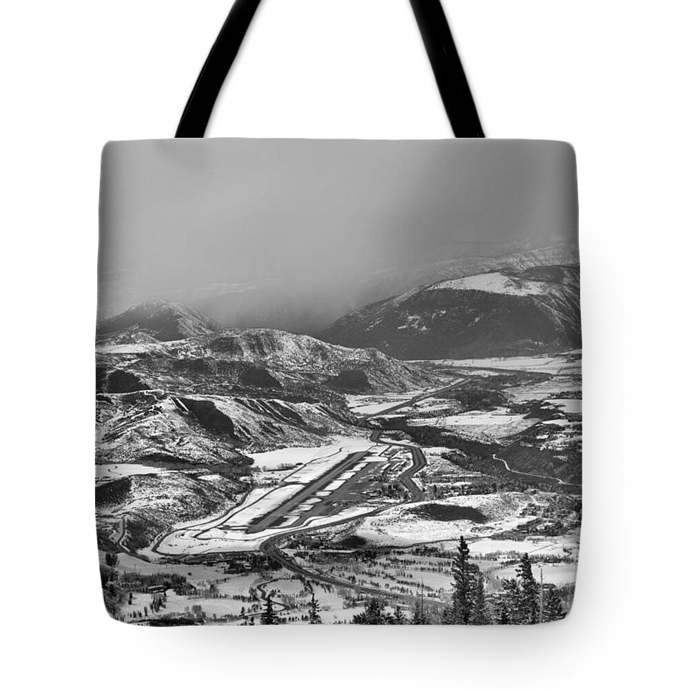 Snowmass Tote Bag featuring the photograph Storm Clouds Over The Aspen Airport Black And White by Adam Jewell