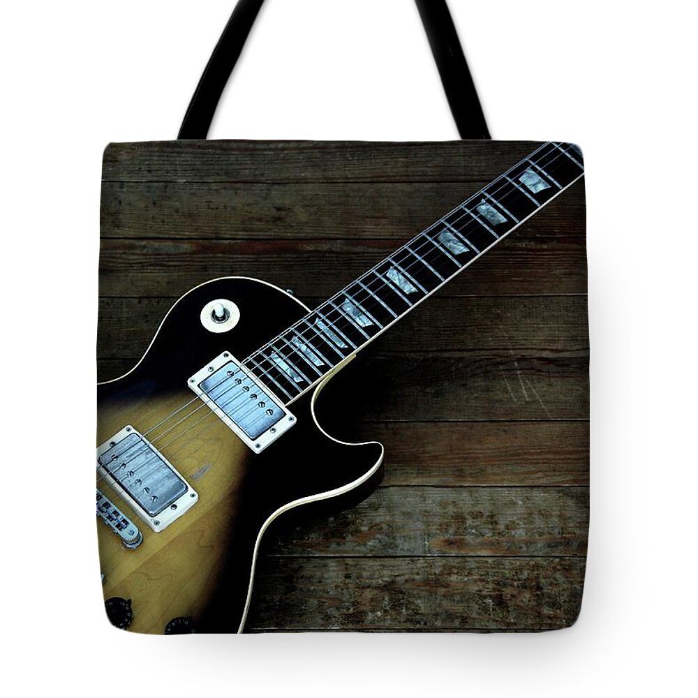 Rock Music Tote Bag featuring the photograph Sunburst Gibson Les Paul by Tito Slack