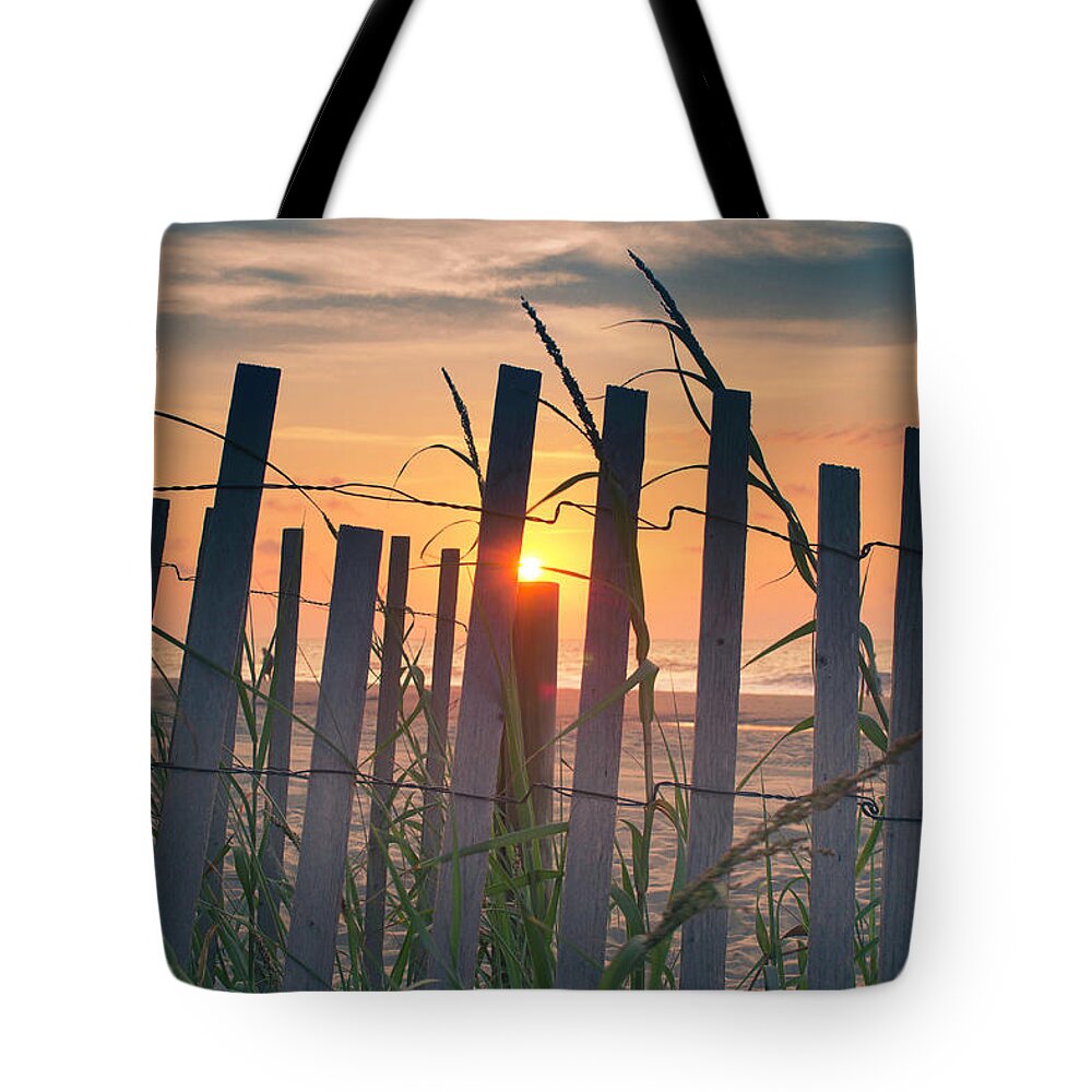 Ocean Tote Bag featuring the photograph Sunrise on post by Darrell Foster