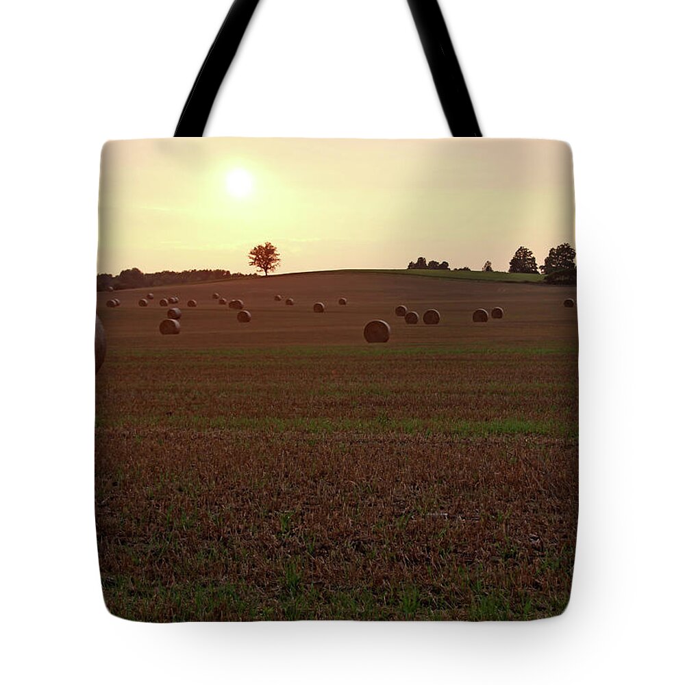 Hay Tote Bag featuring the photograph Sunset And Hay Bales by Debbie Oppermann