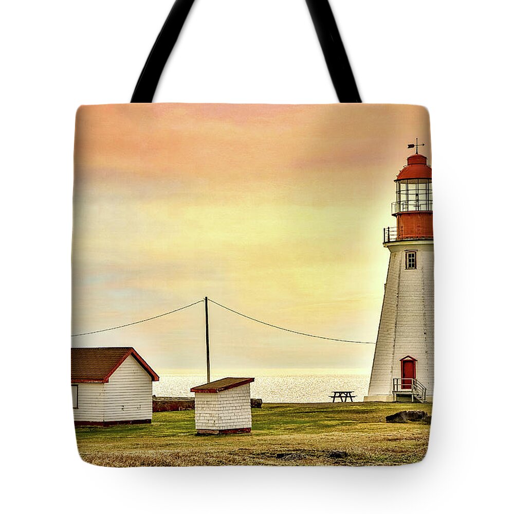  Tote Bag featuring the photograph Sunset at Lighthouse by Paul James Bannerman