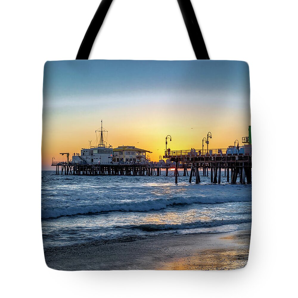 Santa Monica Pier Tote Bag featuring the photograph Sunset Under The Pier by Gene Parks