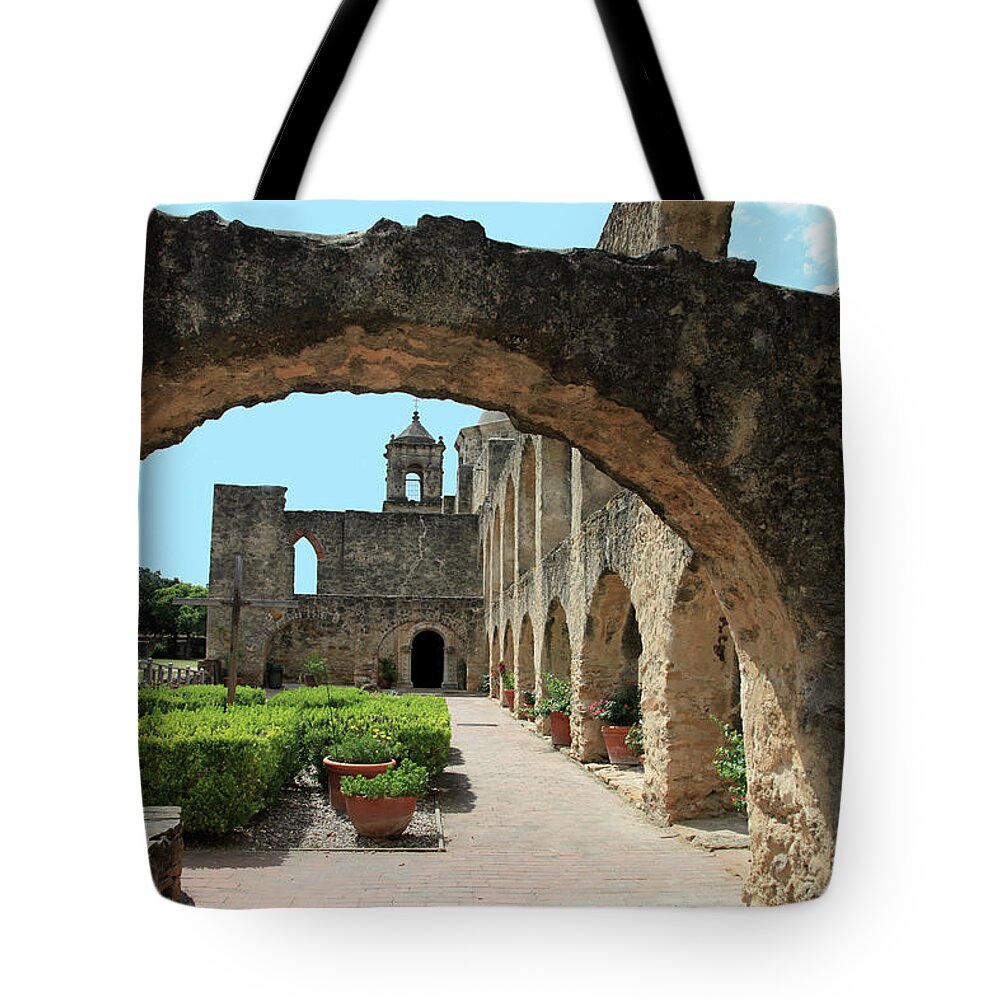 Arch Tote Bag featuring the photograph The Arch And Garden View Of Mission San by Switas