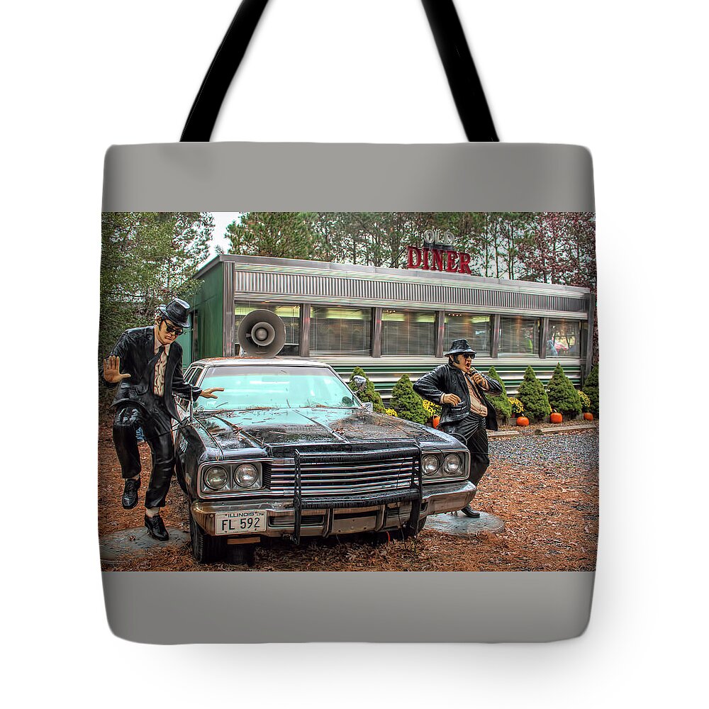 The Blue Brothers Tote Bag featuring the photograph The Blues Brothers At A Diner by Kristia Adams