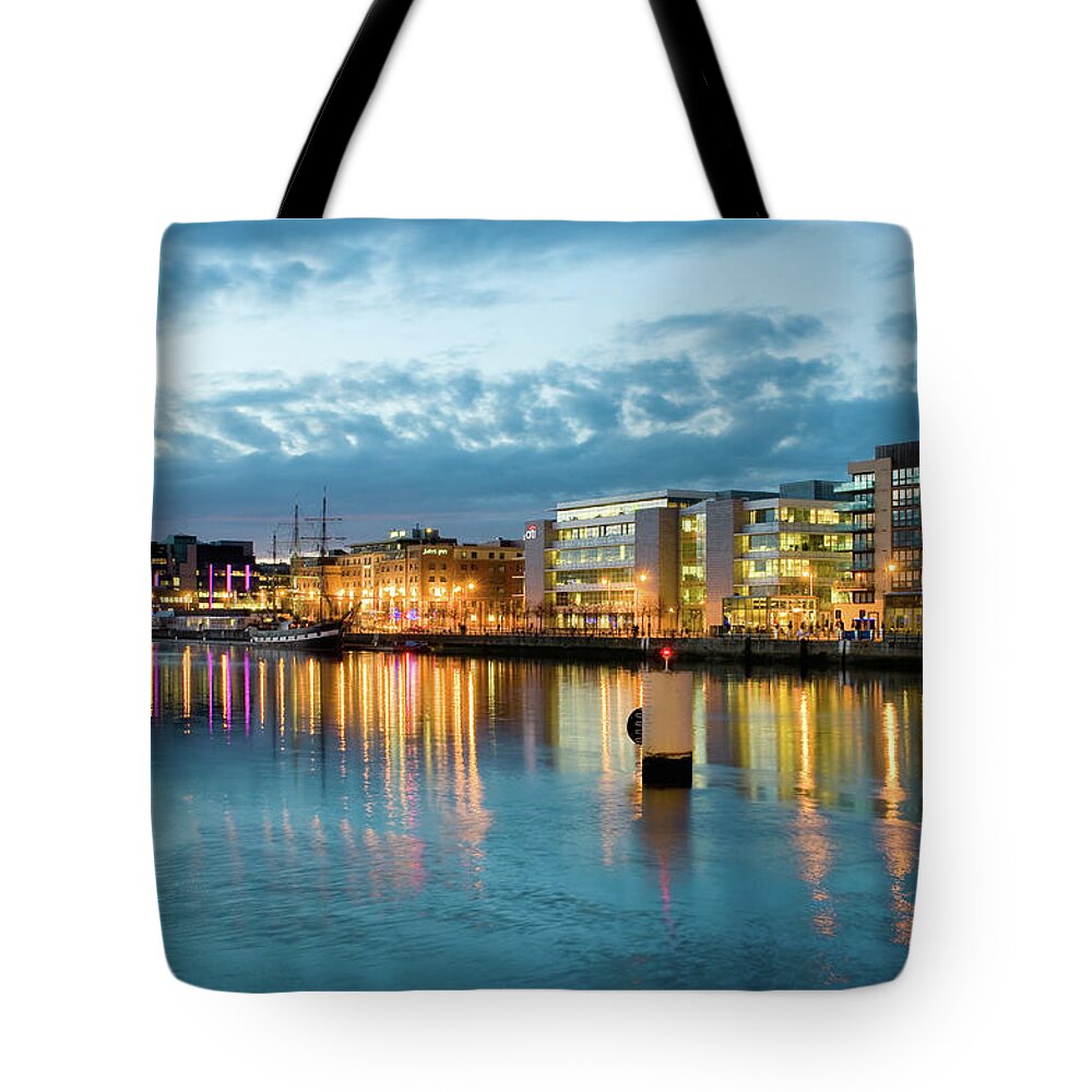 Dublin Tote Bag featuring the photograph The Liffey Riverfront, Custom House by Driendl Group
