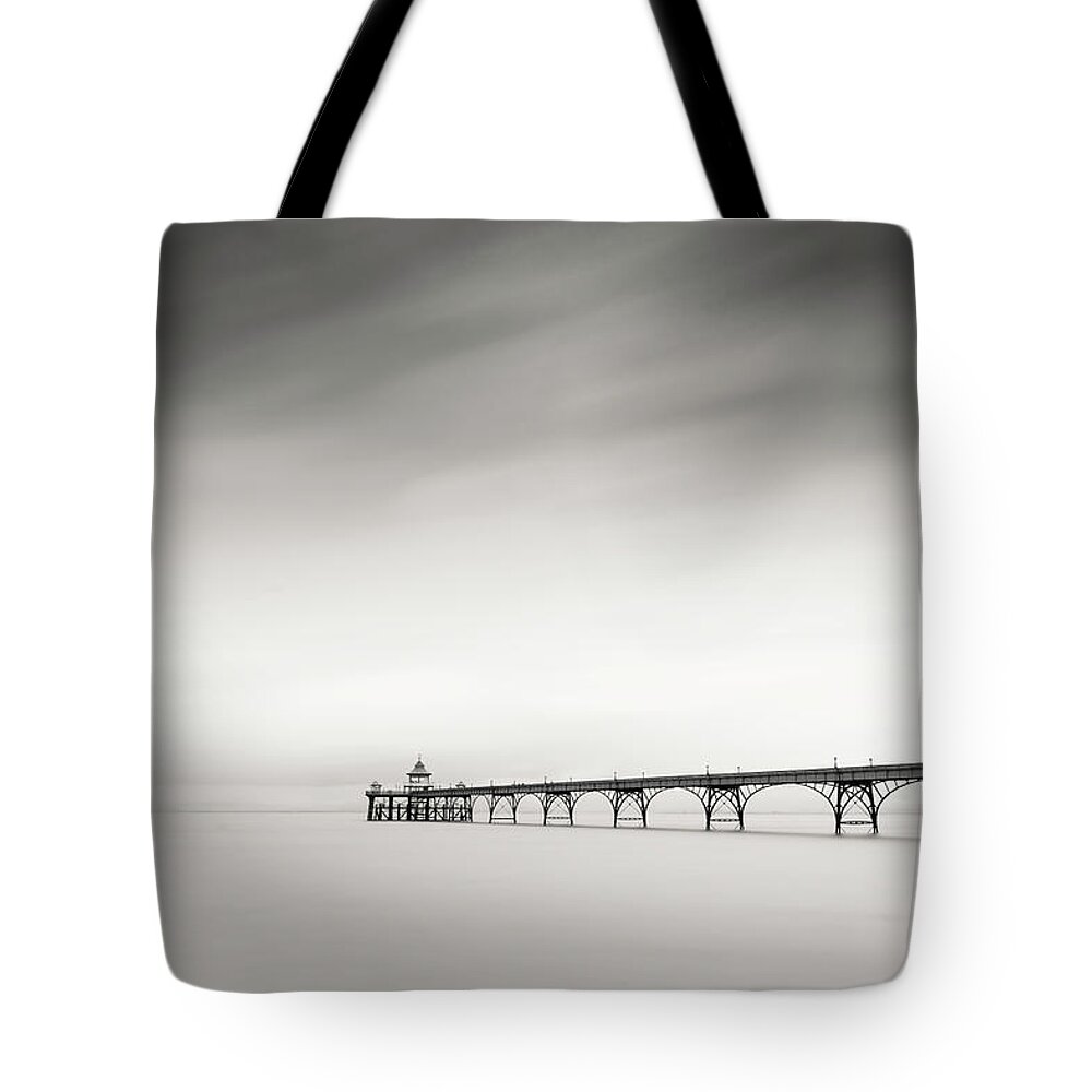 Pier Tote Bag featuring the photograph The old Pier by Dominique Dubied