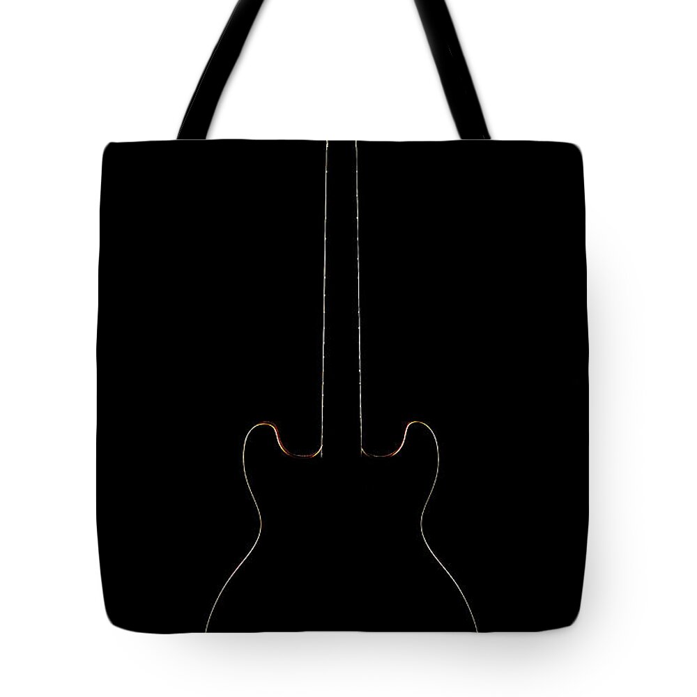 Music Tote Bag featuring the photograph The Silhouette Of The Electric Guitar by Yagi Studio