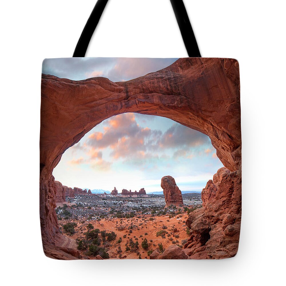 00565366 Tote Bag featuring the photograph The Windows Section From Double Arch At Sunrise, Arches National Park, Utah by Tim Fitzharris