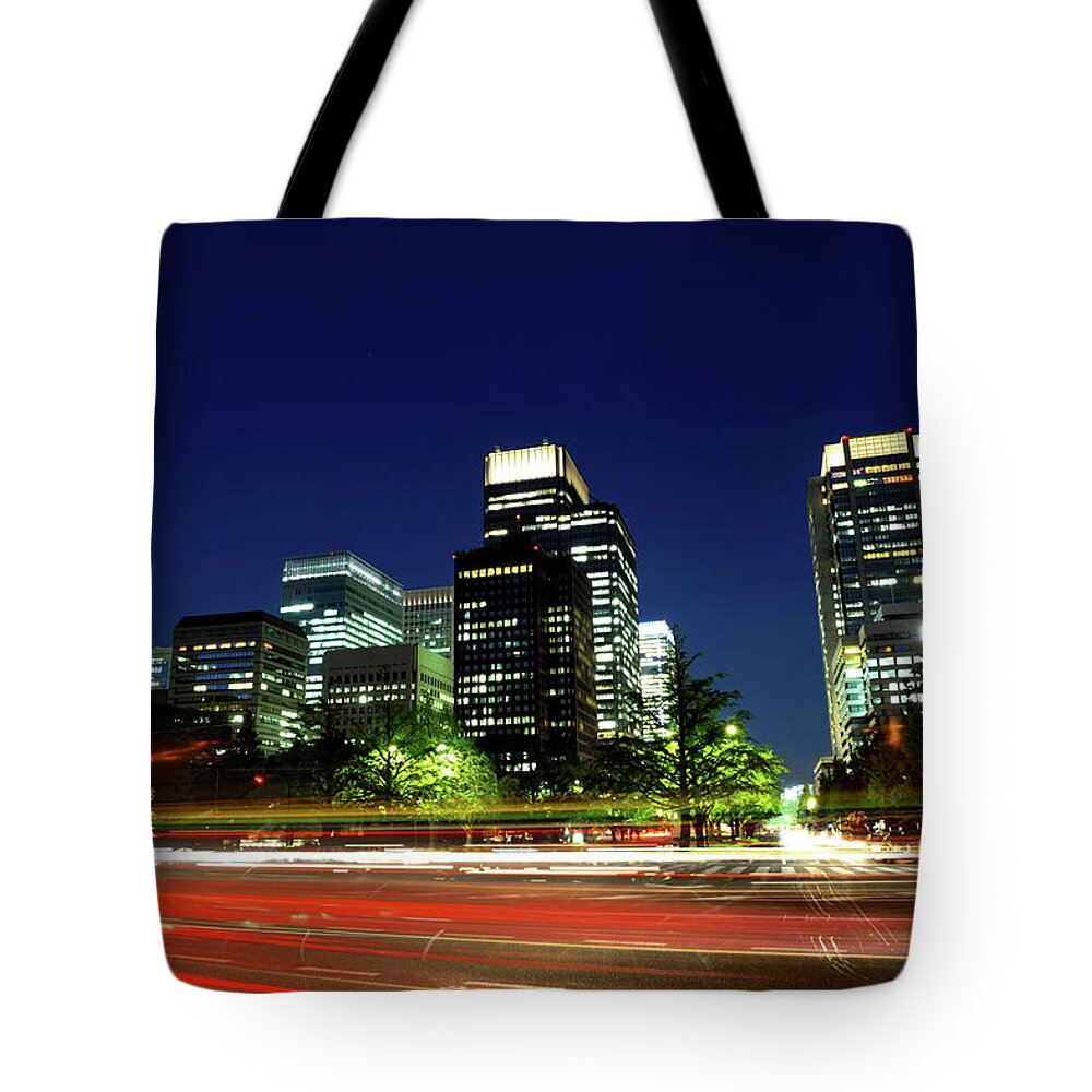 Downtown District Tote Bag featuring the photograph Tokyo Marunouchi At Night by Vladimir Zakharov