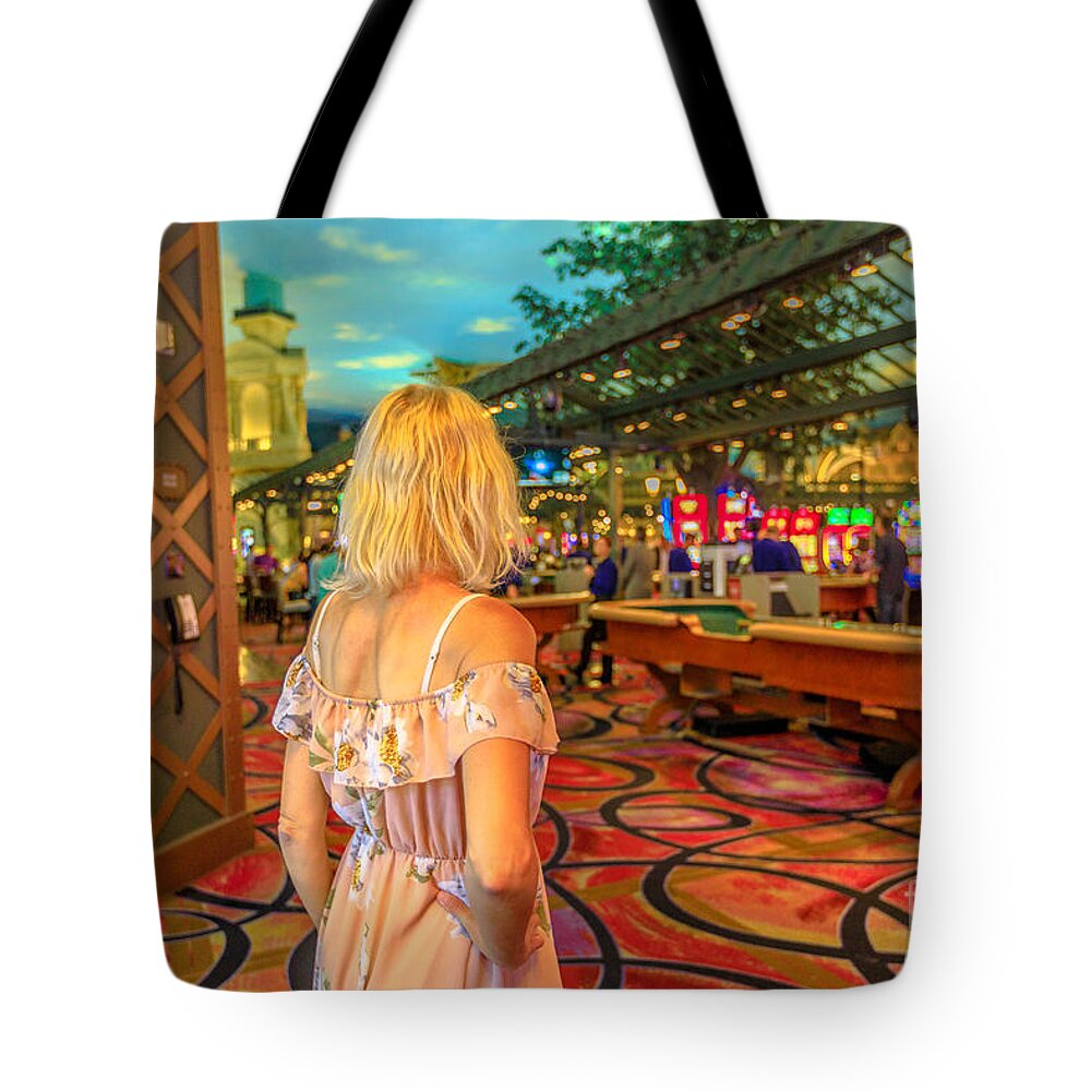 Las Vegas Tote Bag featuring the photograph Tourist woman in casino by Benny Marty