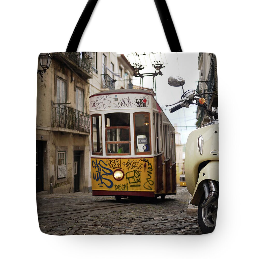 Tranquility Tote Bag featuring the photograph Tram And Motorbike In Lisbon by Mikel Ortega