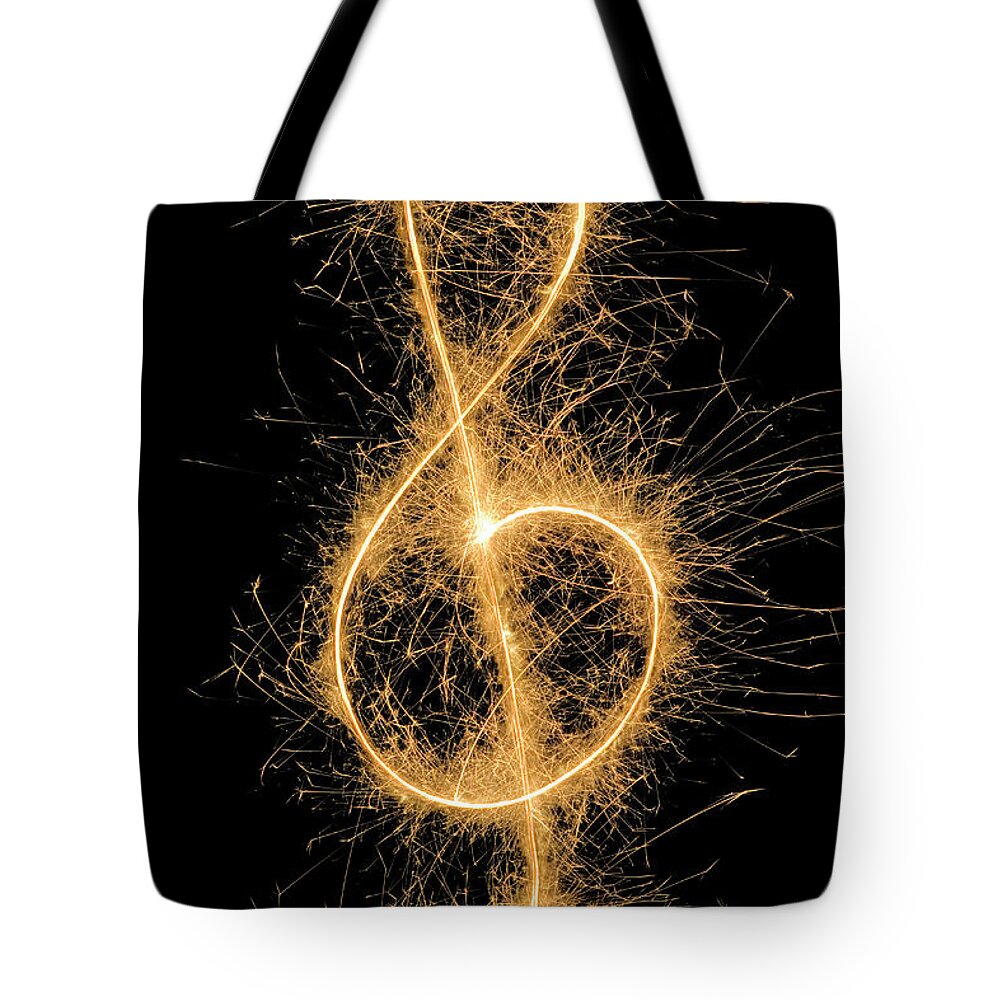 Orange Color Tote Bag featuring the photograph Treble Clef Drawn With A Sparkler by Martin Diebel