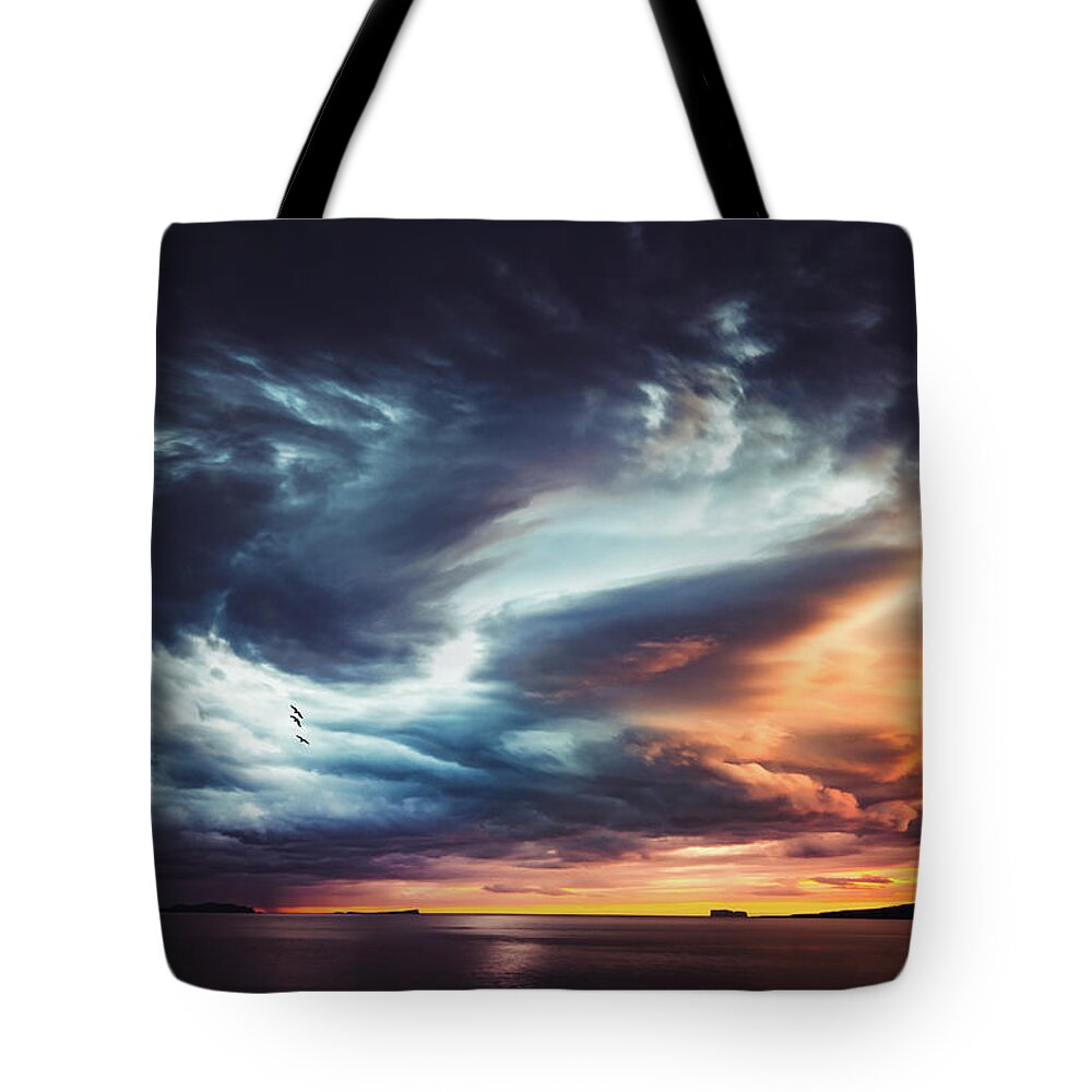 Sky Tote Bag featuring the photograph Trouble in the Sky by Philippe Sainte-Laudy