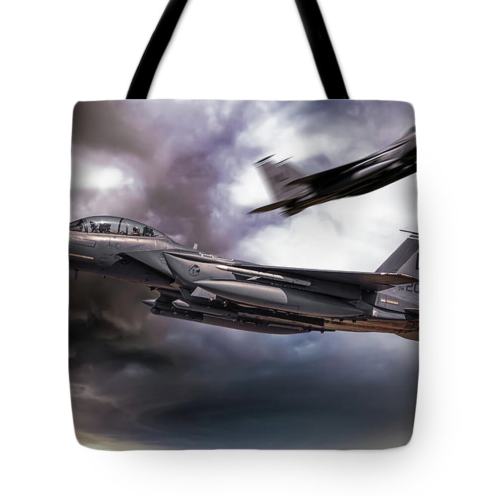F15 Tote Bag featuring the digital art Two F-15E Strike Eagle passing in storm clouds by Simon Bratt