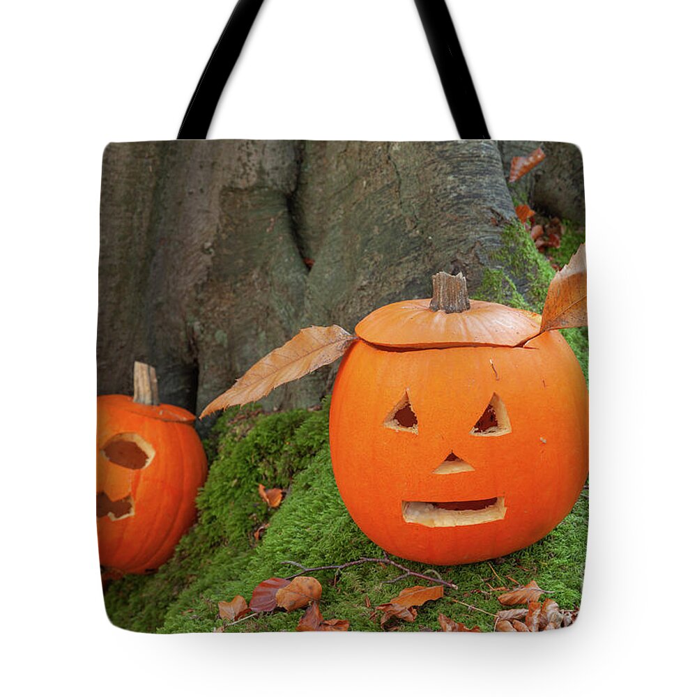 Pumpkin Tote Bag featuring the photograph Two scary pumpkins for halloween by Simon Bratt