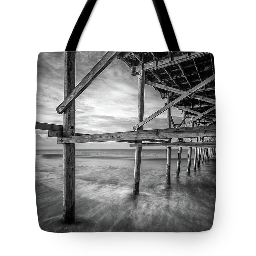 Oak Island Tote Bag featuring the photograph Uner the Pier in Black and White by Nick Noble