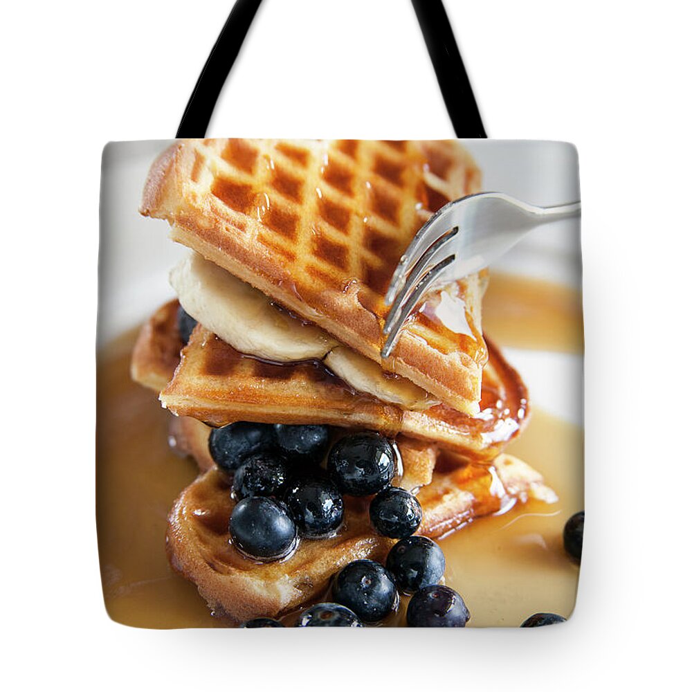 Syrup Tote Bag featuring the photograph Waffels With Golden Syrup And Blue by Devin Hart