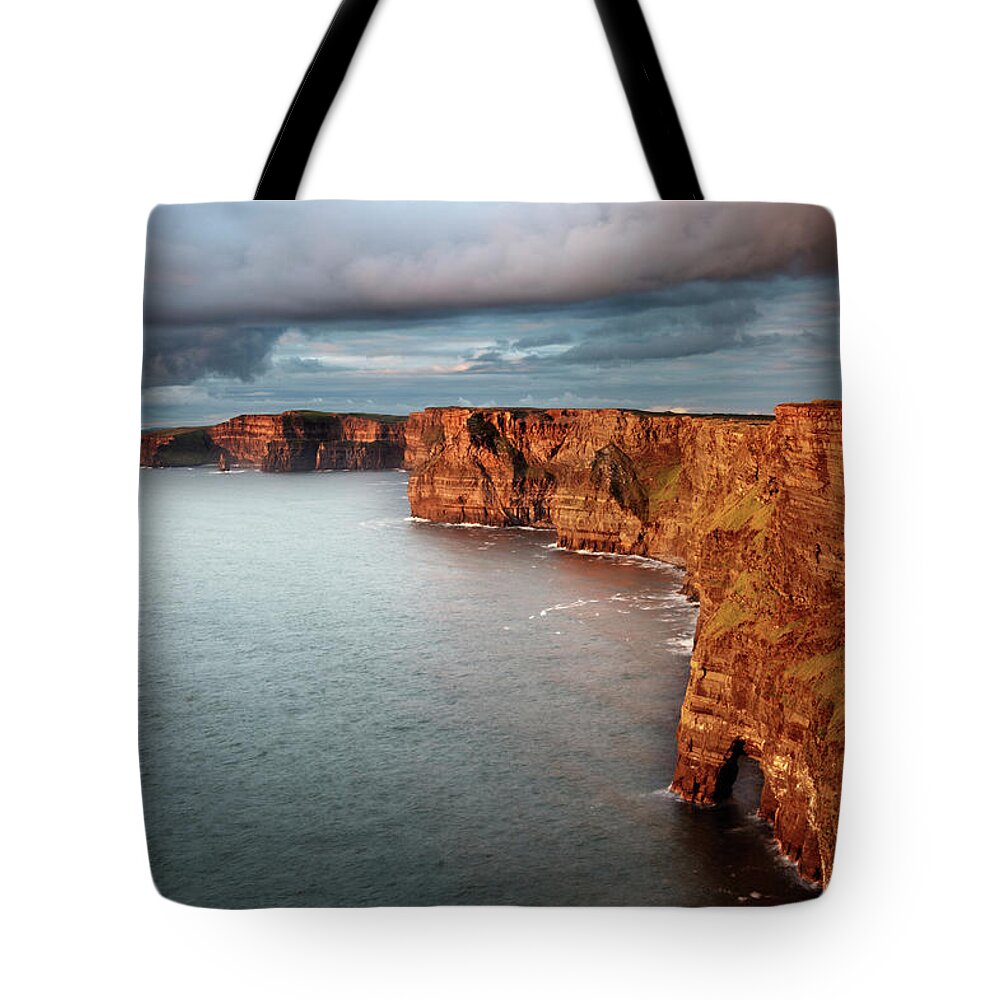 Scenics Tote Bag featuring the photograph Waves Washing Up On Rocky Cliffs by George Karbus Photography