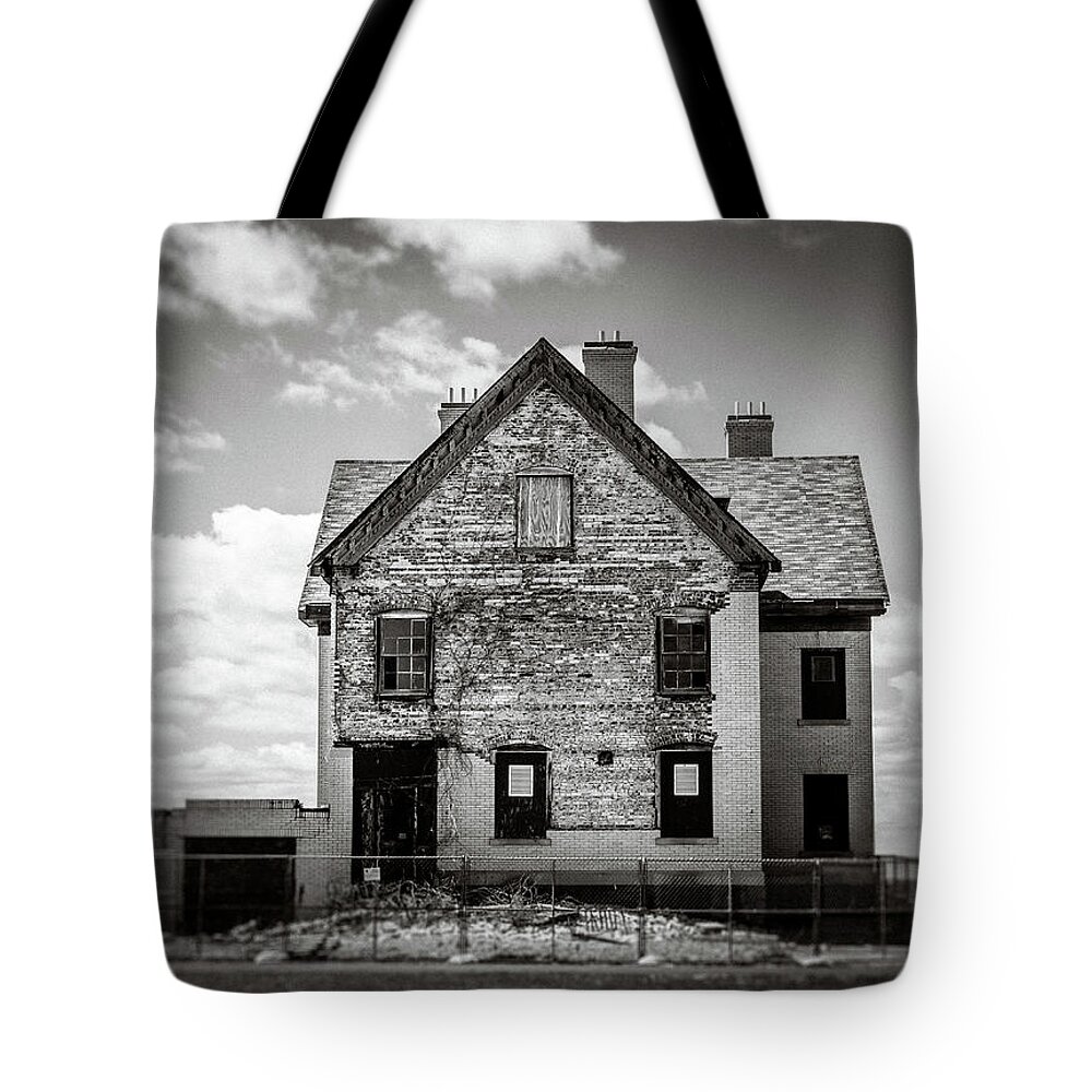 Black And White Tote Bag featuring the photograph What Remains by Steve Stanger