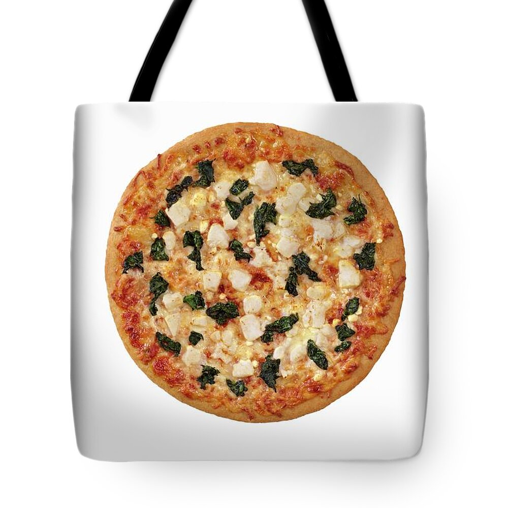 Ip_11166666 Tote Bag featuring the photograph Whole Spinach And Feta Cheese Pizza On A White Background; From Above by Jon Edwards Photography