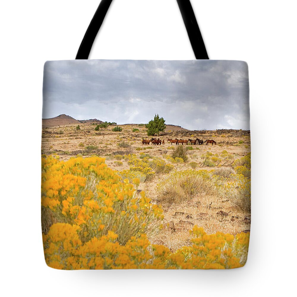 Horse Tote Bag featuring the photograph Wild horses among yellow flowers by Waterdancer