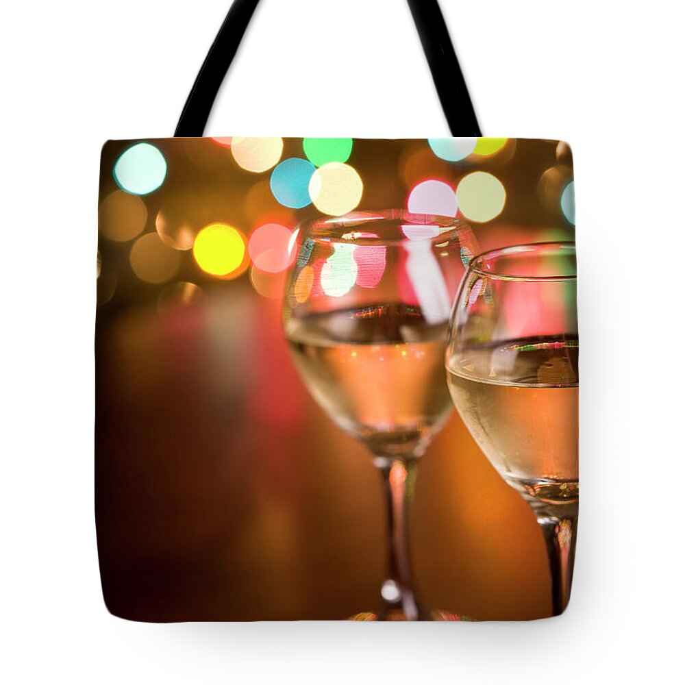 Alcohol Tote Bag featuring the photograph Wine And Christmas Lights by Liliboas